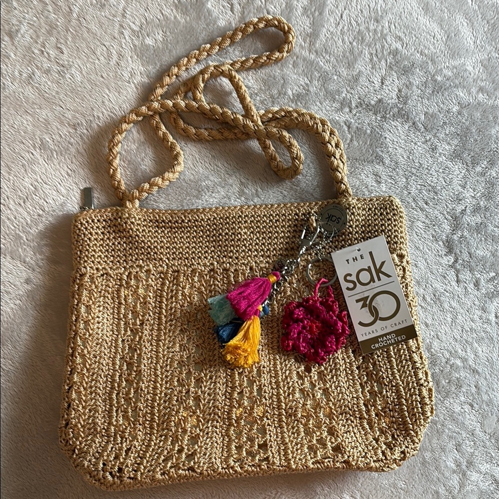 The Sak Gold Crochet Shoulder Bag with Colorful Tassels
